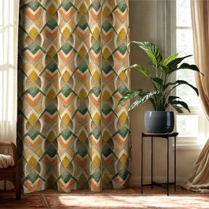 May include: A floor-length curtain featuring a repeating geometric pattern in shades of mustard yellow, forest green, and burnt orange. The design consists of interlocking chevron and diamond shapes that create a structured, rhythmic visual effect.