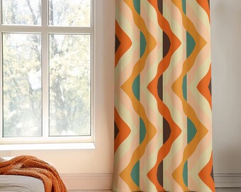 May include: A curtain featuring a repeating vertical pattern of wavy stripes in shades of orange, mustard yellow, teal, dark brown, and cream. The fabric hangs in soft folds, displaying a geometric design with alternating colors and curved lines.
