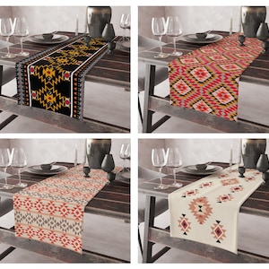 May include: Four table runners with geometric patterns in various colors, including black, red, yellow, and white. The runners are displayed on wooden tables with candles and glasses.