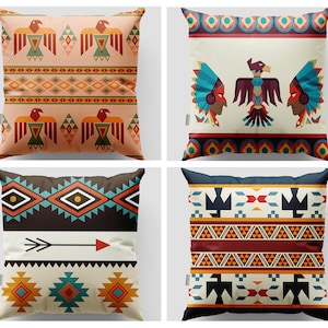 May include: Four decorative throw pillows with Native American inspired patterns. The pillows feature geometric designs in shades of red, orange, yellow, blue, green, and black.