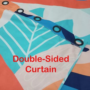 May include: A double-sided curtain featuring a vibrant abstract pattern with geometric shapes in shades of orange, turquoise, dark blue, and cream. The top header includes a row of black circular grommets for hanging, with the text Double-Sided Curtain.