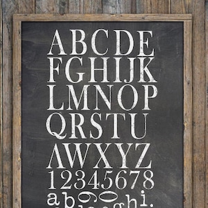 May include: Black chalkboard with a white frame, displaying the alphabet in uppercase and lowercase, along with numbers 1 through 8.