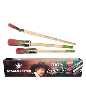May include: A set of STAALMEESTER paint brushes with wooden handles and pink bristles. The brushes have stainless steel ferrules and green and orange accents. A box with the STAALMEESTER logo and product information is also visible.