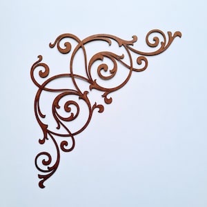 May include: A brown, intricate, decorative corner design with a swirling, floral pattern. This design is perfect for adding a touch of elegance to any project.