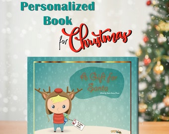 May include: A personalized children's book titled "A Gift for Santa" with a cartoon illustration of a child in a reindeer hat. The cover features a teal background with snowflakes and gold trim. Text above reads "Personalized Book for Christmas."