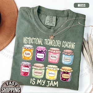 May include: A moss green short-sleeve t-shirt featuring the text "INSTRUCTIONAL TECHNOLOGY COACHING IS MY JAM" and a graphic of eight colorful jars labeled with the words "PLAN," "INNOVATE," "MODEL," "SUPPORT," "INTEGRATE," "EMPOWER," "REFLECT," and "COLLABORATE."