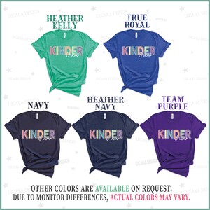 May include: Six different color t-shirts with the text "Kinder Crew" in rainbow colors. The shirts are available in Heather Kelly, True Royal, Navy, Heather Navy, and Team Purple.