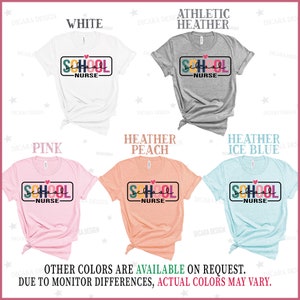 May include: Five different color t-shirts with a colorful graphic of a school sign that says "School Nurse" on it. The colors are white, heather gray, pink, heather peach, and heather ice blue.