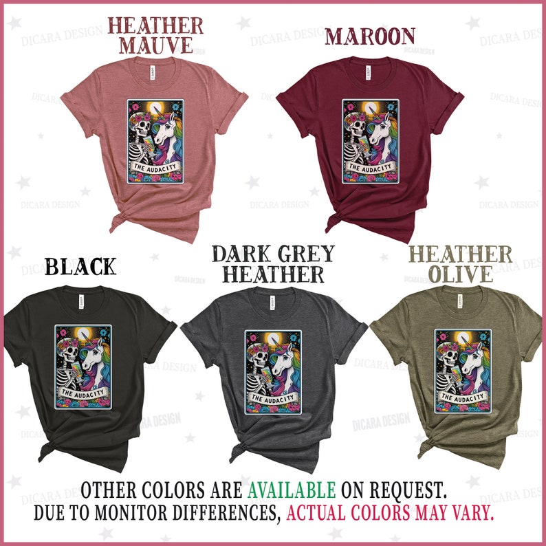 May include: A collection of t-shirts featuring a skeleton and unicorn design with the text "The Audacity". The shirts are available in heather mauve, maroon, black, dark grey heather, and heather olive.