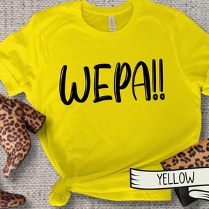 May include: Yellow t-shirt with the text "WEPA!" printed in black.