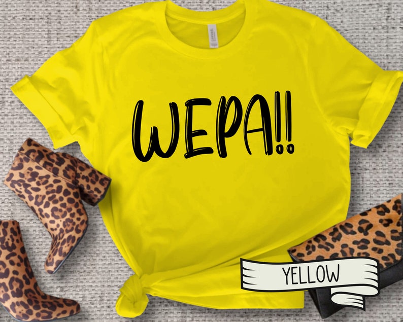 May include: Yellow t-shirt with the text "WEPA!" printed in black.
