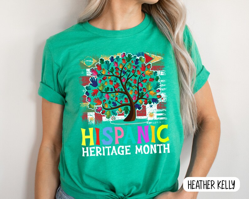 May include: A green t-shirt with a colorful tree design and the text "Hispanic Heritage Month".