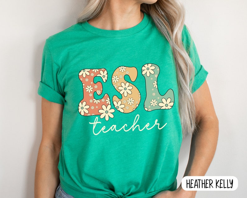 May include: Green t-shirt with the text "ESL teacher" in colorful letters with a floral pattern.