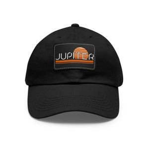 May include: Black baseball cap with a patch featuring a sunset graphic and the word "JUPITER" in white text.