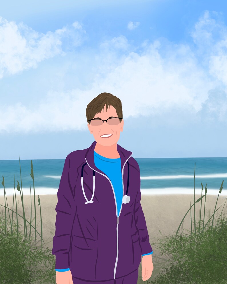 May include: A woman wearing a purple medical scrubs jacket with a stethoscope around her neck. She is standing on a sandy beach with tall grass and blue water in the background.