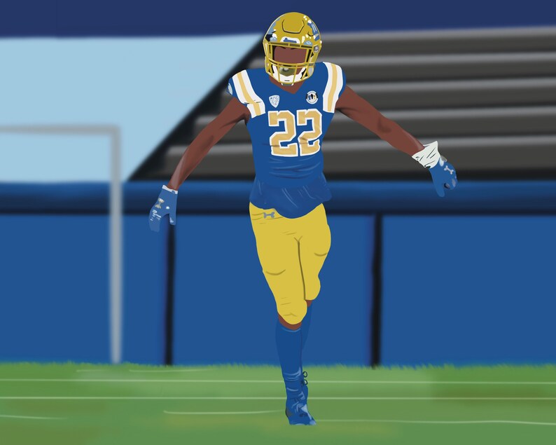 May include: A football player wearing a blue and gold uniform with the number 22 on the front. The player is wearing a helmet and gloves. The player is standing on a green field with a blue fence in the background.