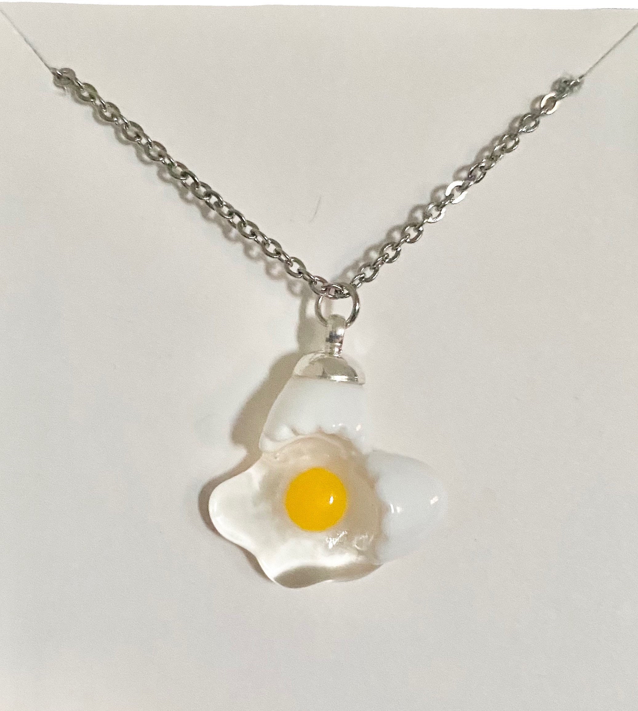 【AMBUSH】CRACKED EGG CHARM NECKLACE 2色展開 Silver Gold AMBUSH(アンブッシュ) 通販サイト 【CRACKED EGG CHARM NECKLACE】