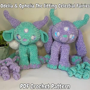 May include: PDF crochet pattern for two sitting celestial fairies, one in teal and one in lavender. The fairies have large eyes and horns, and are sitting with their legs crossed.