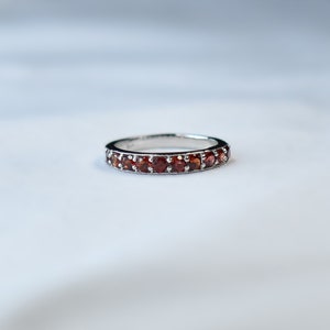 Natural 3mm Prong Set Half Eternity Garnet Wedding Band In Sterling Silver