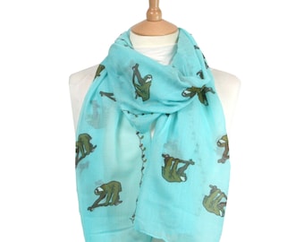 Womens mint sloth scarf with a fairy light design in a gift bag. Made of a soft polyester/Cotton blend. Perfect for an animal & sloth lover