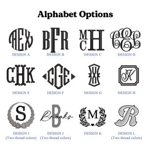 May include: Alphabet options for embroidery designs.  Design A is a circular monogram with three letters. Design B is a block monogram with three letters. Design C is a monogram with two letters stacked on top of each other. Design D is a circular monogram with three letters. Design E is a block monogram with three letters. Design F is a diamond-shaped monogram with three letters. Design G is a monogram with two letters stacked on top of each other. Design H is a square monogram with one letter. Design I is a circular monogram with one letter and a wreath. Design J is a handwritten monogram with one letter. Design K is a monogram with one letter and a wreath. Design L is a monogram with one letter.
