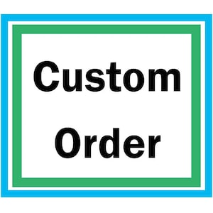 May include: A blue and green framed sign with the text "Custom Order" in black.
