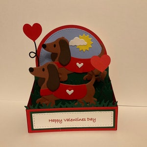 Tarjeta emergente de San Valentín, amor y aniversario con un perro salchicha hecha a mano