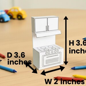 A papercraft miniature stove and upper cabinet unit with height, width, and depth measurements shown by arrows.