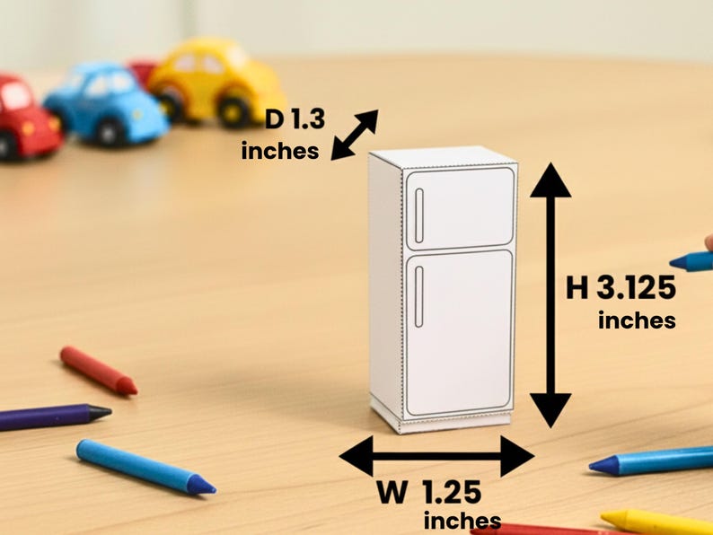 A papercraft miniature refrigerator with dimension overlays indicating height, width, and depth on a wooden surface.