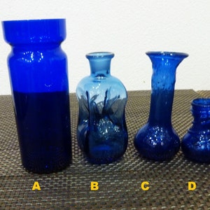 Vintage cobalt blue glass bottles.