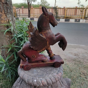Wooden handpainted carved jumping horse/handcrafted horse/artistic figurines/wood carved horse/wheel  horse/wooden horse/painted horse.