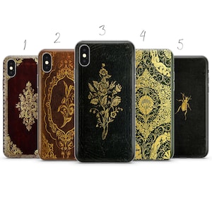 May include: Five rectangular smartphone cases arranged in a row, numbered one through five. Each case features a distinct design: a dark red with gold filigree, a brown with gold floral patterns, a black with a gold rose bouquet, a green with gold damask, and a black with a single gold beetle.