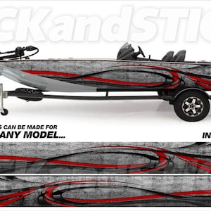 May include: A gray and black boat wrap with red accents. The wrap features a swirling design with a distressed look. The boat is on a trailer and the text "PICKandSTICK" is visible on the boat and the trailer. The text "3M CUSTOM SIZES CAN BE MADE FOR ANY MAKE... ANY MODEL..." is visible below the boat. The text "FREE INSTALL KIT" is visible in the lower right corner of the image.