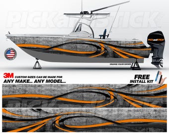 May include: A boat wrap design featuring a gray and black abstract pattern with orange accents. The design is shown on a gray boat with a white background. The text "CUSTOM SIZES CAN BE MADE FOR ANY MAKE... ANY MODEL..." is shown below the boat. The text "FREE INSTALL KIT" is shown in the bottom right corner of the image.