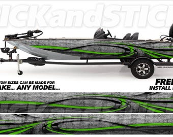 May include: A black and green boat wrap with a gray and white abstract design. The wrap features a green and black swirl pattern with a gray and white background. The text "PICKandSTICK" is visible on the boat. The text "CUSTOM SIZES CAN BE MADE FOR ANY MAKE... ANY MODEL..." is visible below the boat. The text "FREE INSTALL KIT" is visible below the wrap.