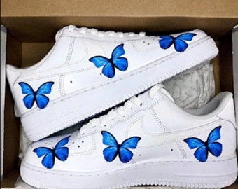 white nike butterfly shoes