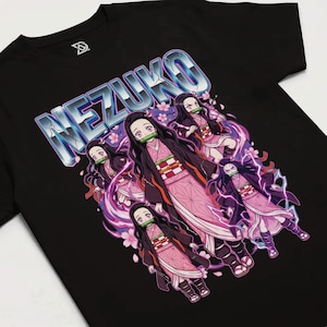 May include: Black t-shirt with a graphic of the character Nezuko from the anime series Demon Slayer. The design features multiple images of Nezuko in a pink kimono, with the name "NEZUKO" in a silver, 3D-style font.