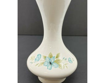 青い花柄の陶器花瓶 青い花柄とターコイズ色の内側が入った陶器の花瓶。Anna 1972 VTG の