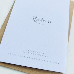 May include: White card with black text that reads "Number 58 Designs" and "Handmade in Nottinghamshire" followed by a website address: http://number58designs.etsy.com