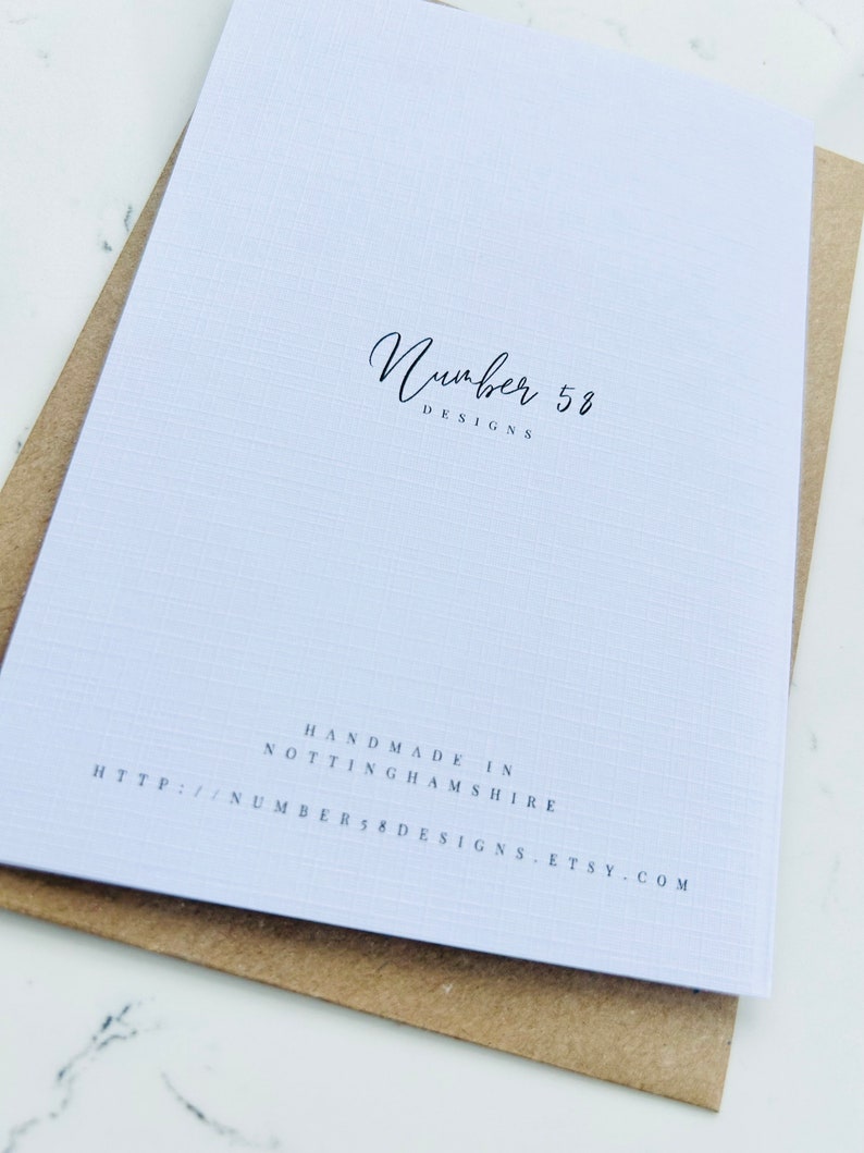 May include: White card with black text that reads "Number 58 Designs" and "Handmade in Nottinghamshire" followed by a website address: http://number58designs.etsy.com