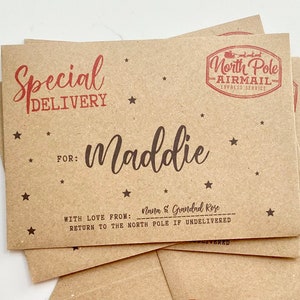 May include: A brown paper envelope with a red "Special Delivery" stamp and a red "North Pole Airmail" stamp. The envelope is addressed to "Maddie" with the message "With love from: Nana & Grandad Rose" and "Return to the North Pole if undelivered".