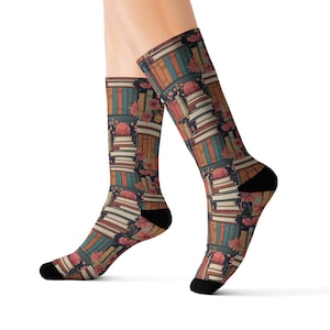 May include: A pair of colorful socks with a pattern of stacked books and flowers. The socks are made of a soft, comfortable material and are perfect for everyday wear.