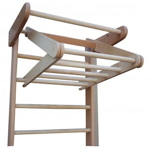 May include: Wooden climbing frame with a horizontal ladder and a pull-up bar. The pull-up bar is adjustable and can be moved to different heights.
