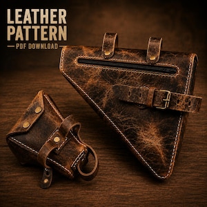 May include: A dark brown distressed leather triangular bicycle frame bag and a smaller matching tool pouch. Both items feature brass-colored hardware, buckle straps, and visible stitching. The text LEATHER PATTERN PDF DOWNLOAD is visible.