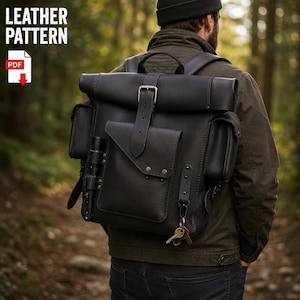 May include: A black leather roll-top backpack featuring a central buckled pocket, two side pockets, a flashlight holder, and a metal key ring attachment. The text LEATHER PATTERN and a PDF icon are visible in the upper left corner of the image.