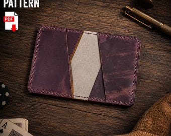 May include: A rectangular leather card holder featuring a deep purple exterior with a central light gray vertical panel. The item is stitched with matching thread and displays the text LEATHER PATTERN and PDF on the upper left side.