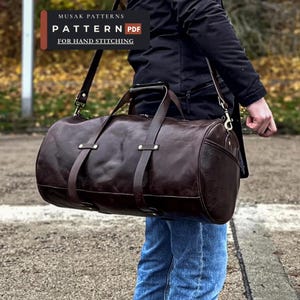 May include: A dark brown leather duffel bag with two top handles and a detachable shoulder strap. The bag features vertical leather straps with metallic rivets. Text on the image reads: MUSAK PATTERNS PATTERN PDF FOR HAND STITCHING.