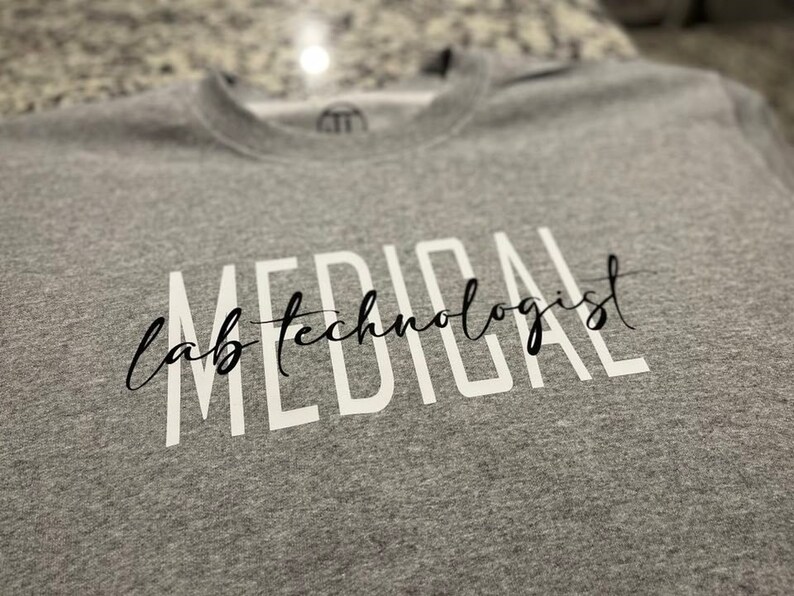 May include: Gray sweatshirt with the text "MEDICAL lab technologist" printed in white.