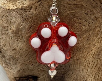 Pendentif perle de verre orange avec empreinte de patte, fermoir en argent sterling