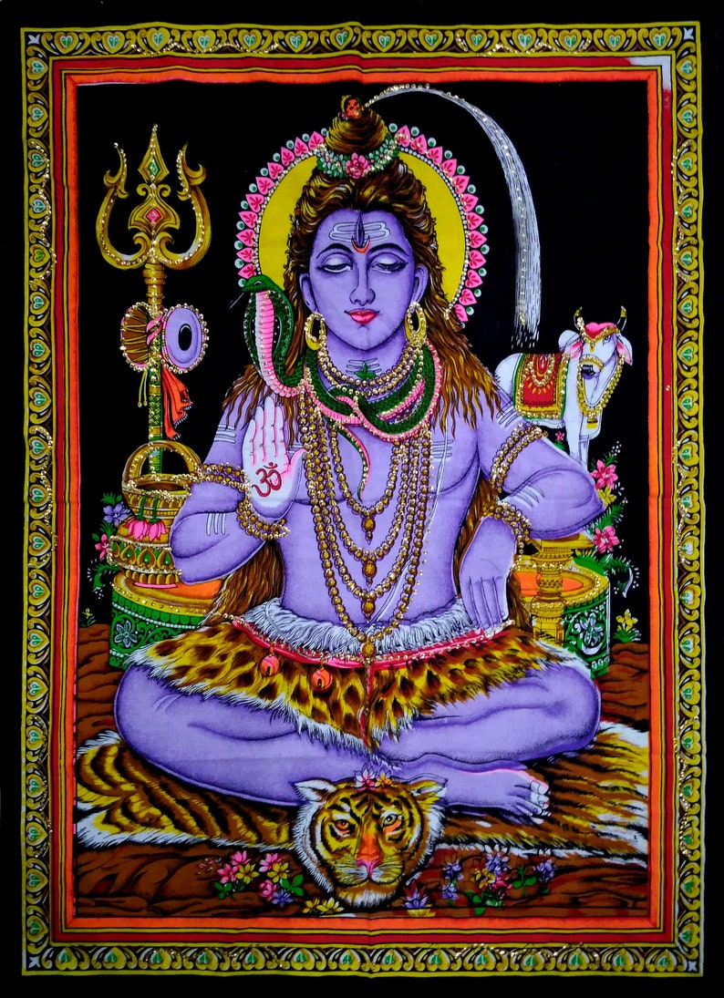 May include: A colorful tapestry depicting the Hindu deity Shiva, seated in a meditative pose with a snake around his neck. He is adorned with jewelry and surrounded by symbols of his power, including a trident, a tiger, and a cow. The tapestry is framed with a gold border.